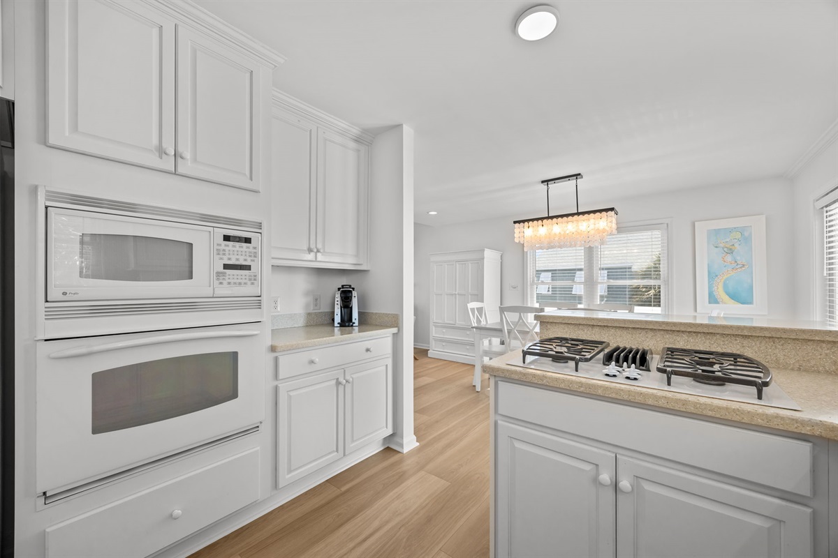 Open kitchen with breakfast bar and dining area just steps away