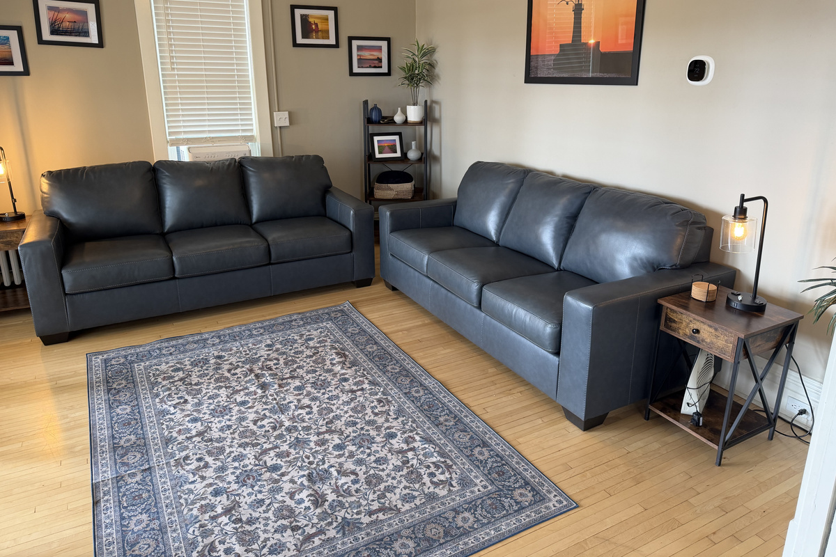 Enjoy our brand new HOM Furniture couches (2026) while taking in the Lake Superior Views or just watching some TV. 