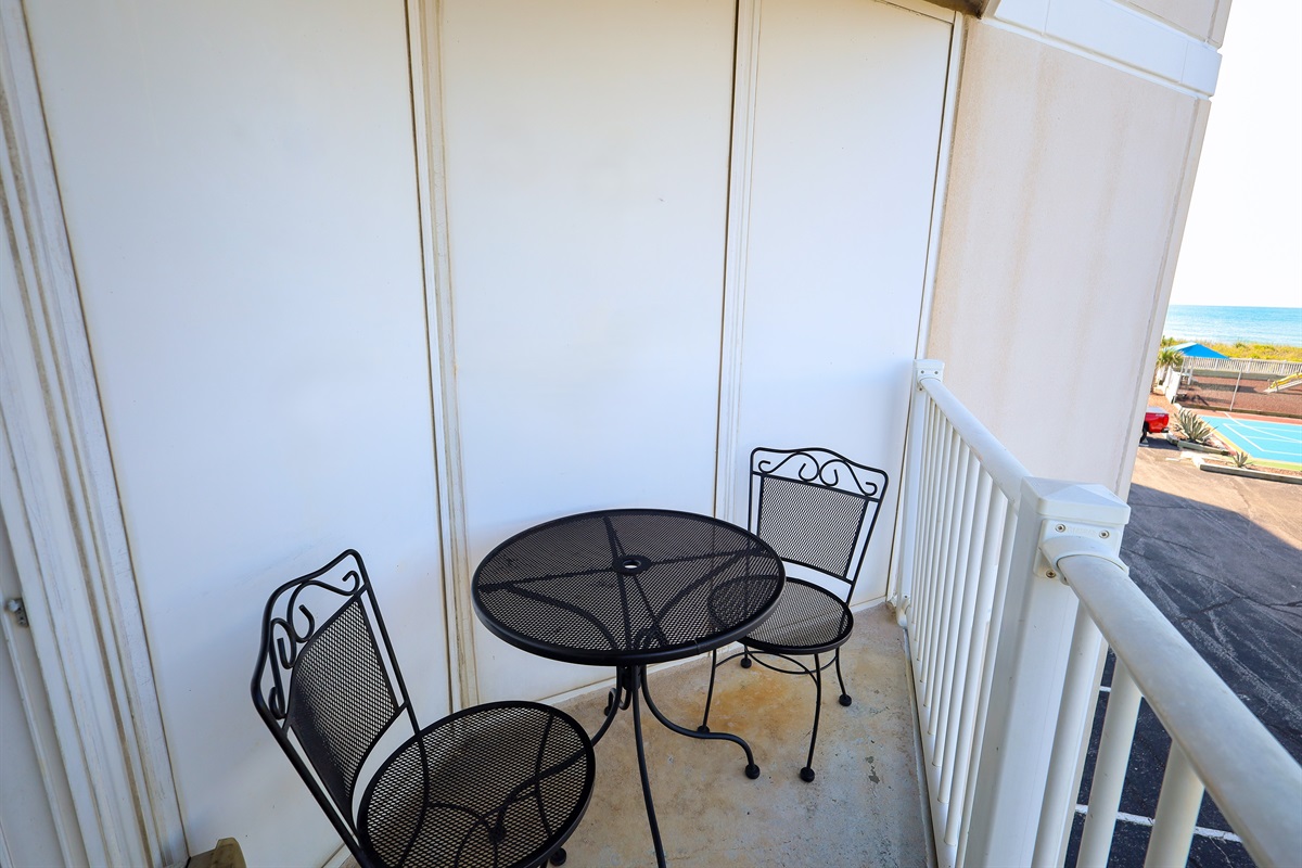 Outdoor dining set on the balcony, overlooking the ocean!