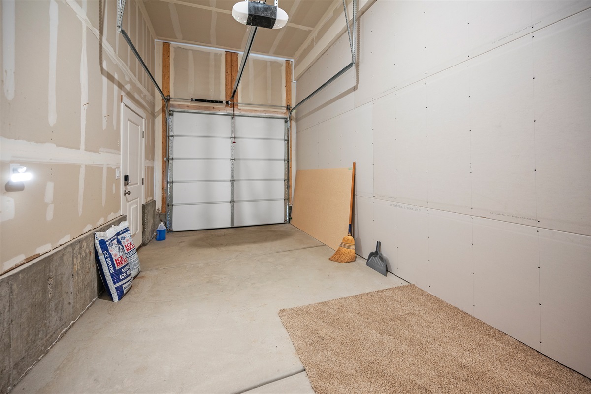 A dedicated one-car garage is available for downstairs guests, offering secure parking and easy access to the unit.