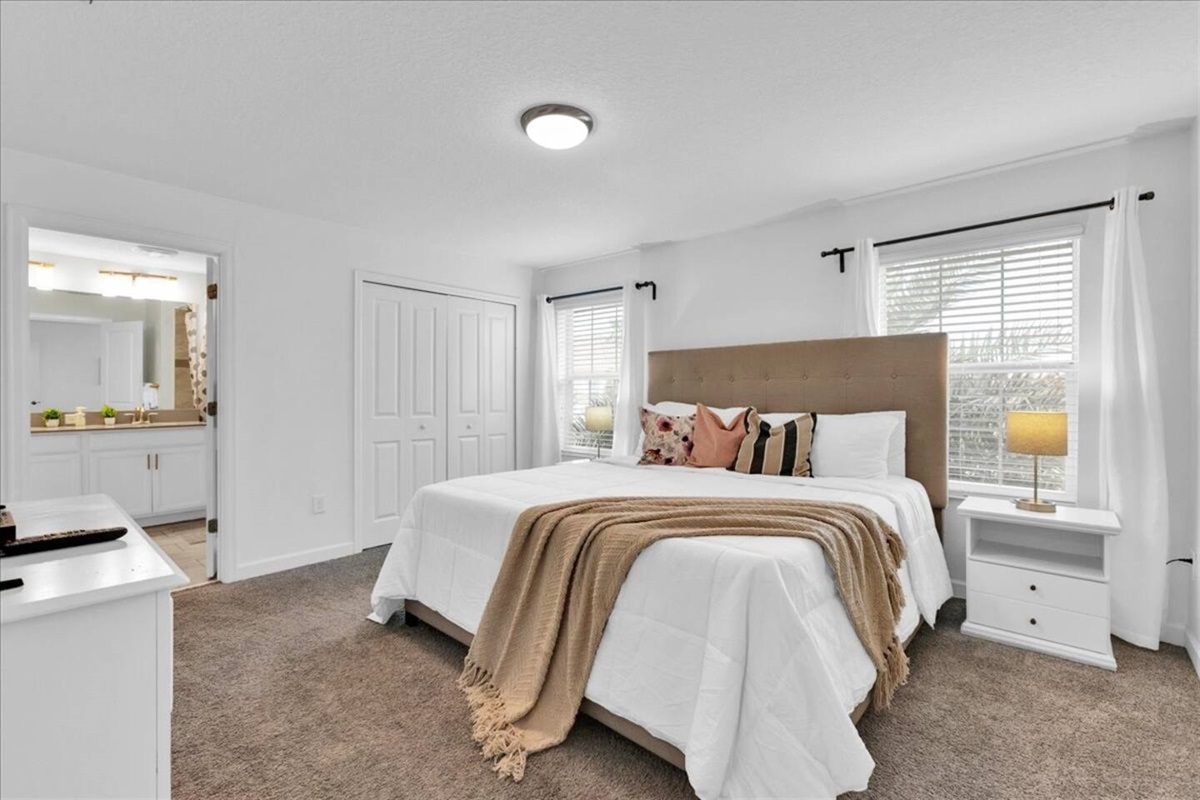 The Master bedroom presents a King bed, a private ensuite bathroom, and its own TV