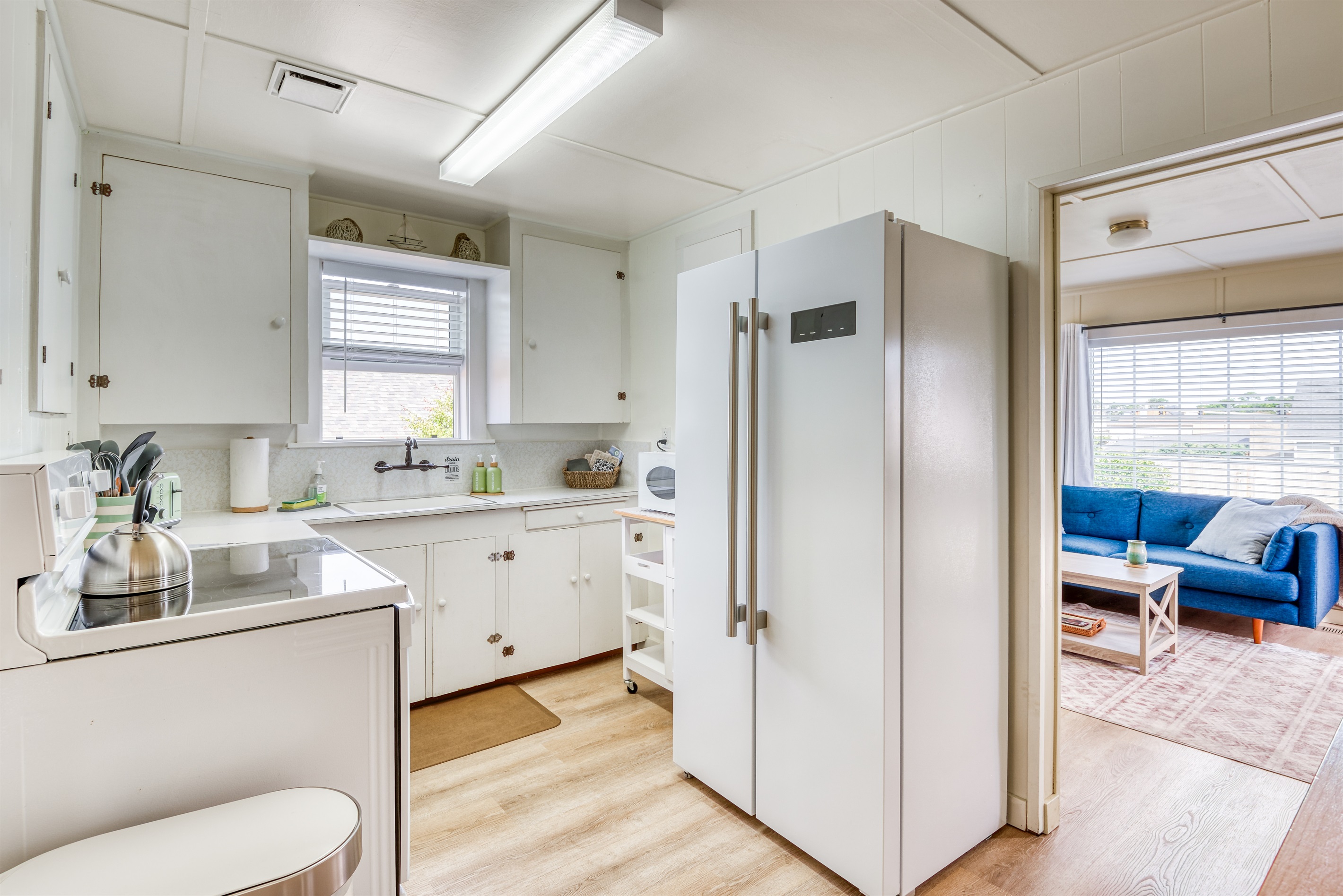 Kitchen with Side By Side Refrigerator Freezer