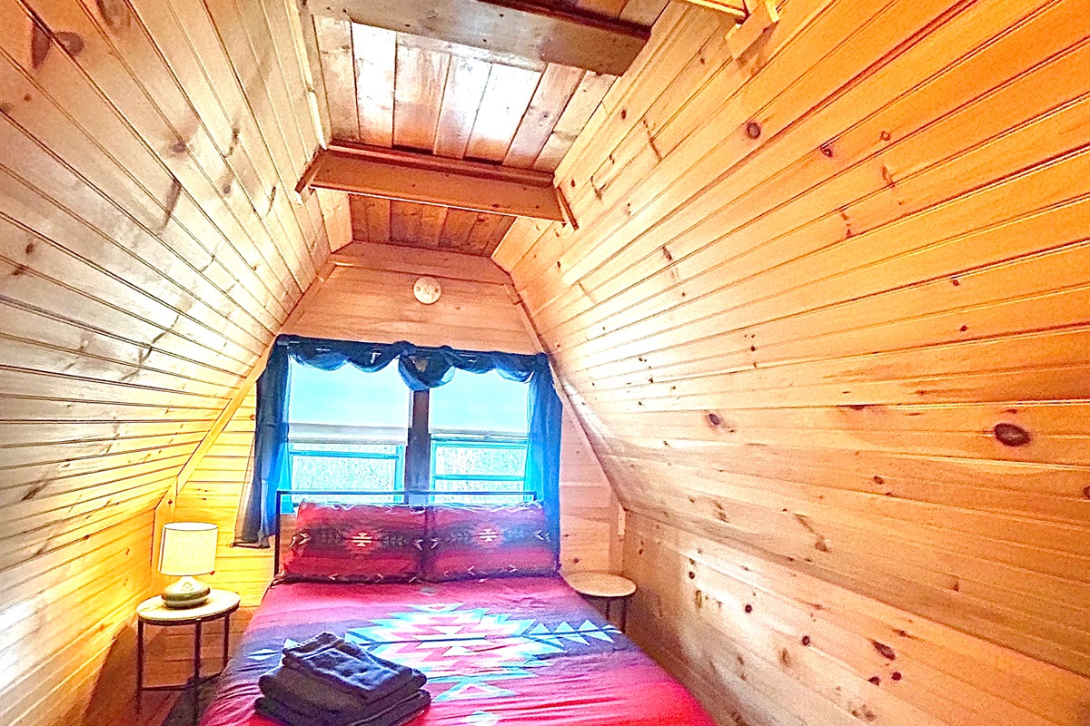 Second loft bedroom with full sized bed. Please note there is an open doorway between loft one and loft two.