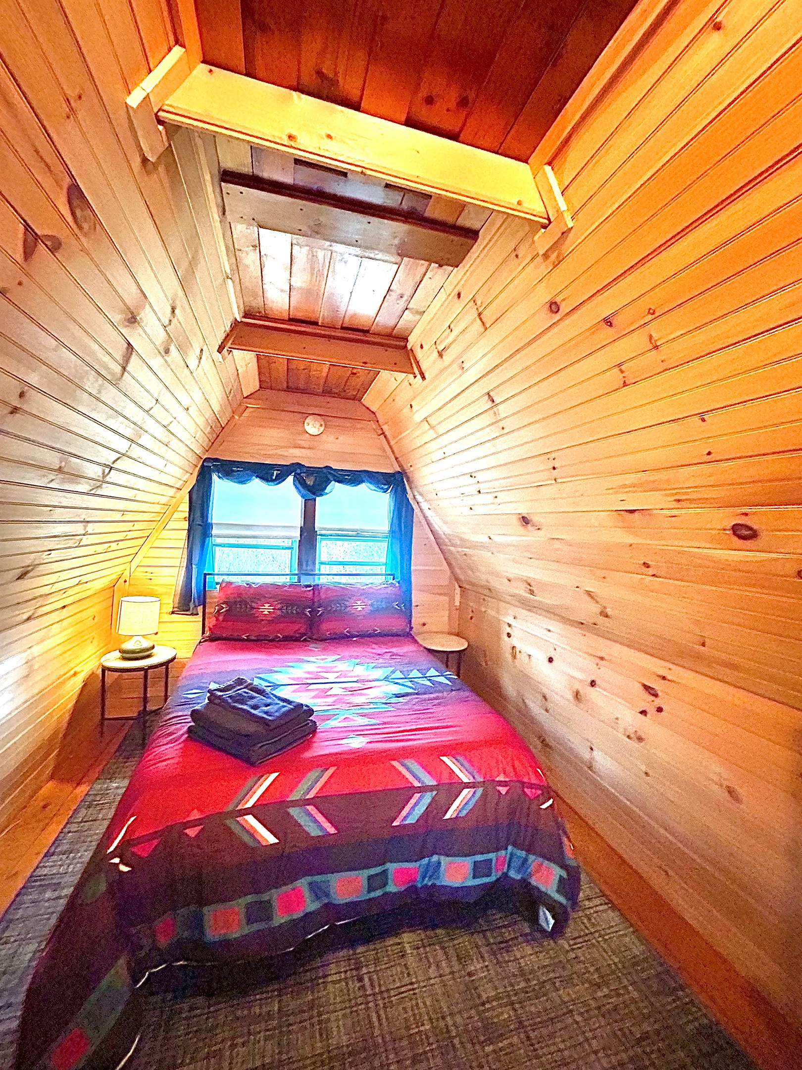 Second loft bedroom with full sized bed. Please note there is an open doorway between loft one and loft two.