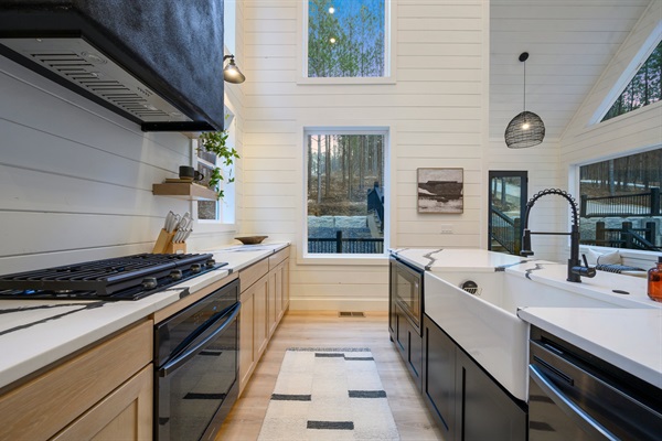 The oversized farmhouse sink and high-end appliances make cooking both stylish and effortless.