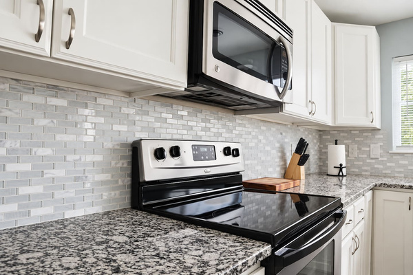 Gourmet Kitchen: Cook up beach-inspired meals in this stylish, modern kitchen with sleek finishes!