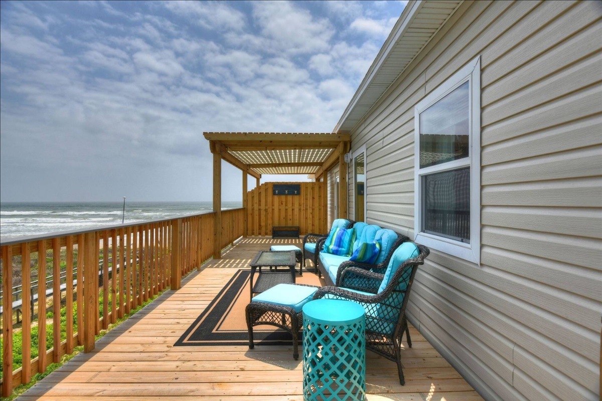 Relax and enjoy the gulf breeze under this partially cover porch