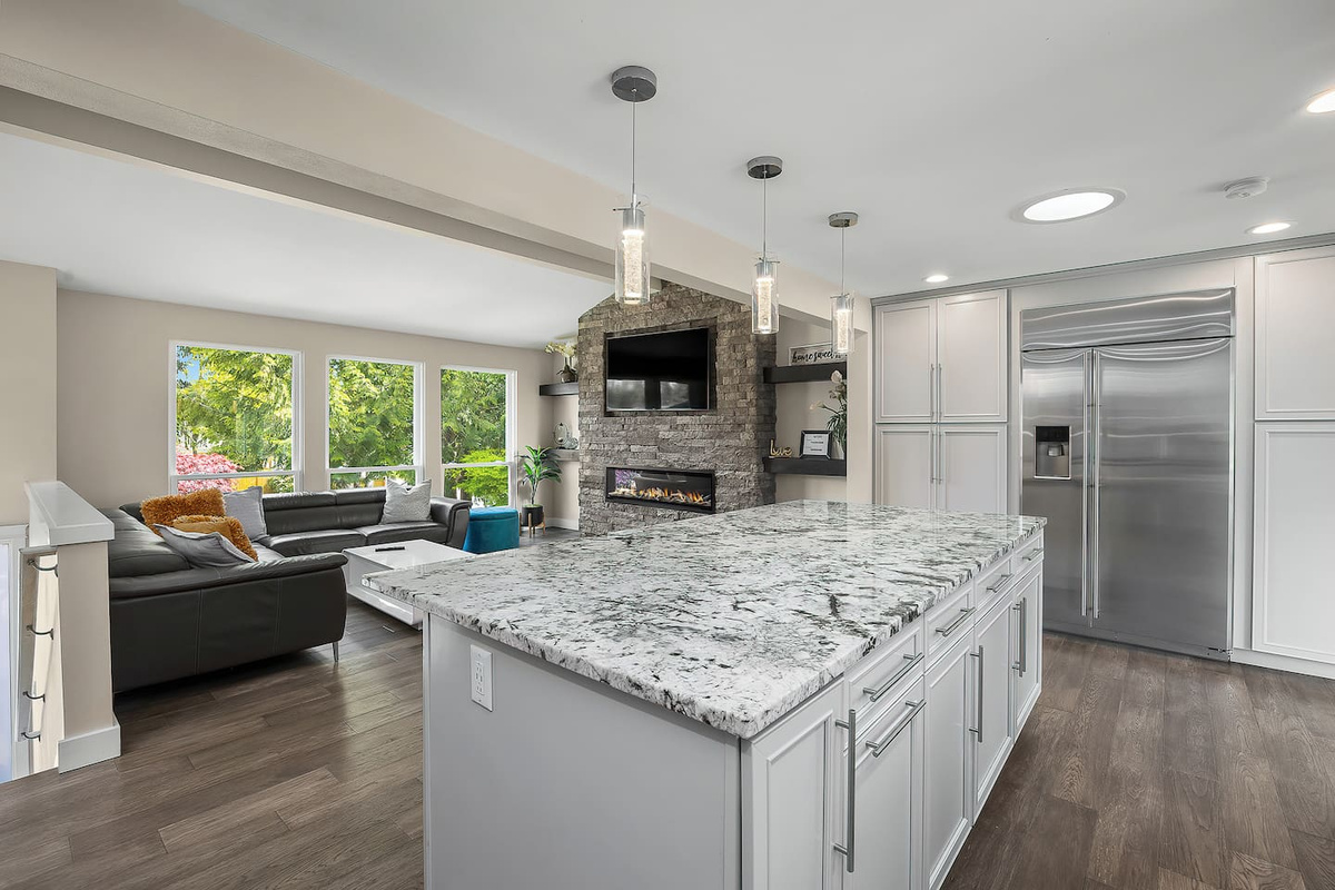 “Experience elevated comfort in this gourmet kitchen, where sleek granite countertops, thoughtful lighting, and top-tier appliances come together in perfect harmony.”