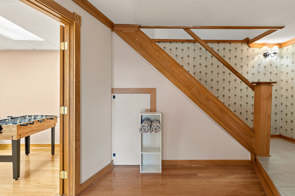 Interior staircase with wooden railing