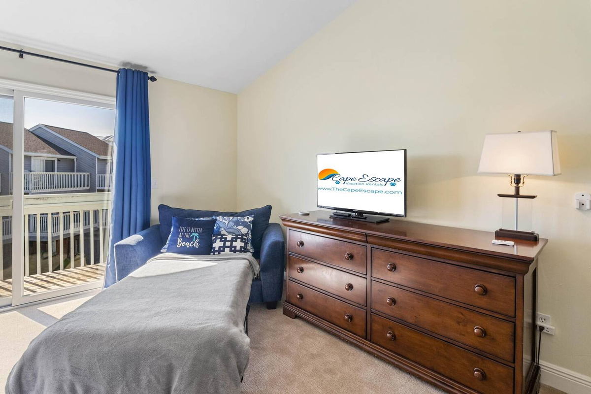 Smart TV and Large Sleeper Chair in Master Suite