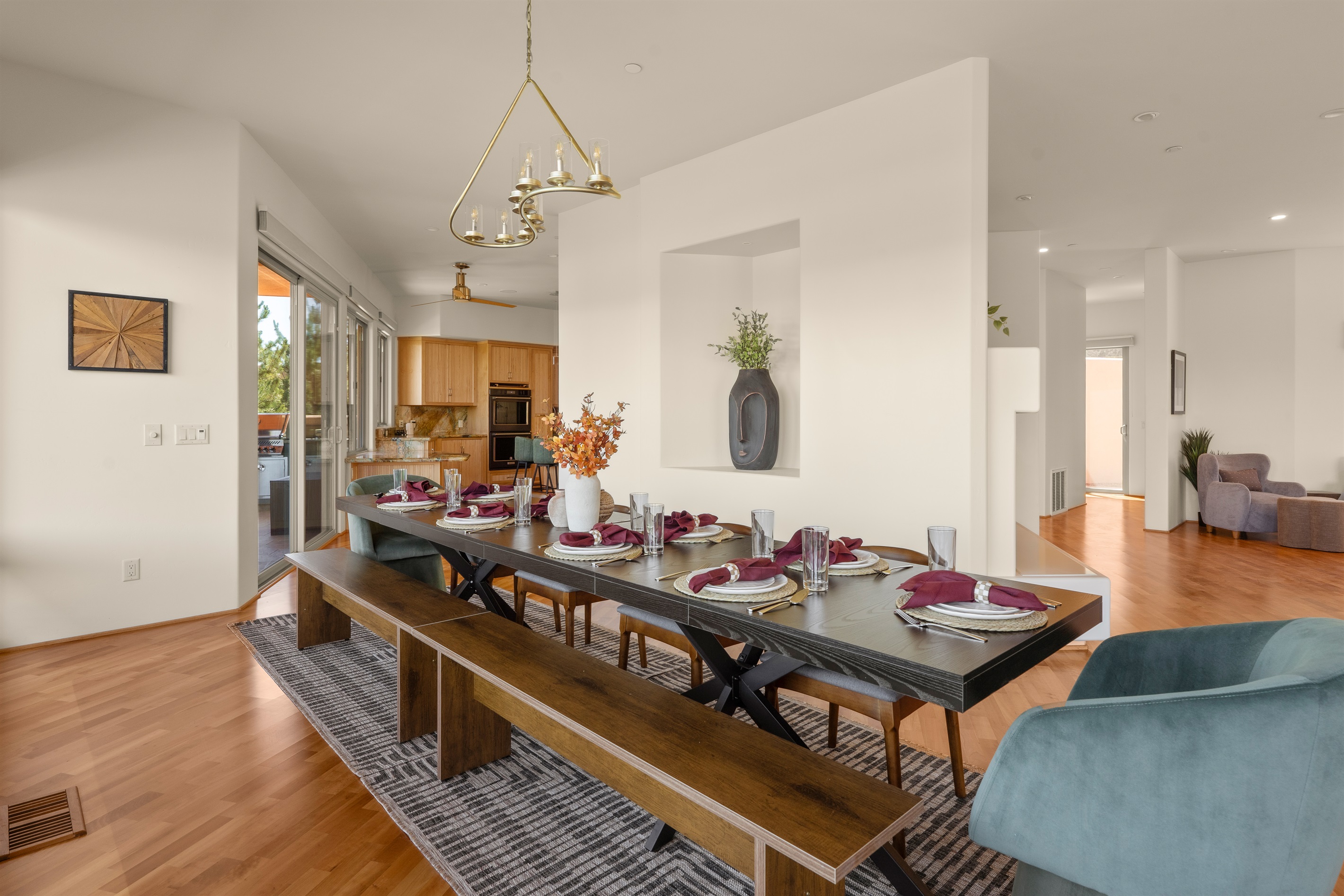 Gather the whole family. Our expansive, open-concept dining area features a massive custom table with seating for everyone, seamlessly connecting to the chef's kitchen and outdoor patio.