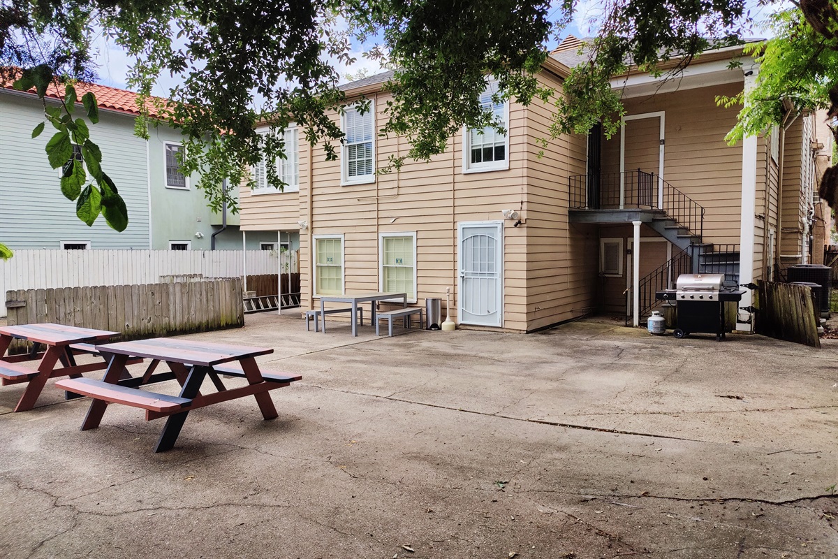 Rear courtyard shared with upstairs unit.