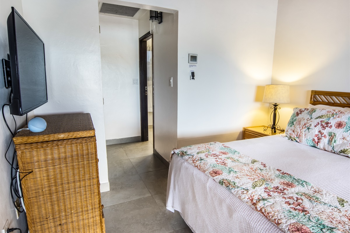 Private hallway leading to the en-suite bathroom for added comfort and convenience.