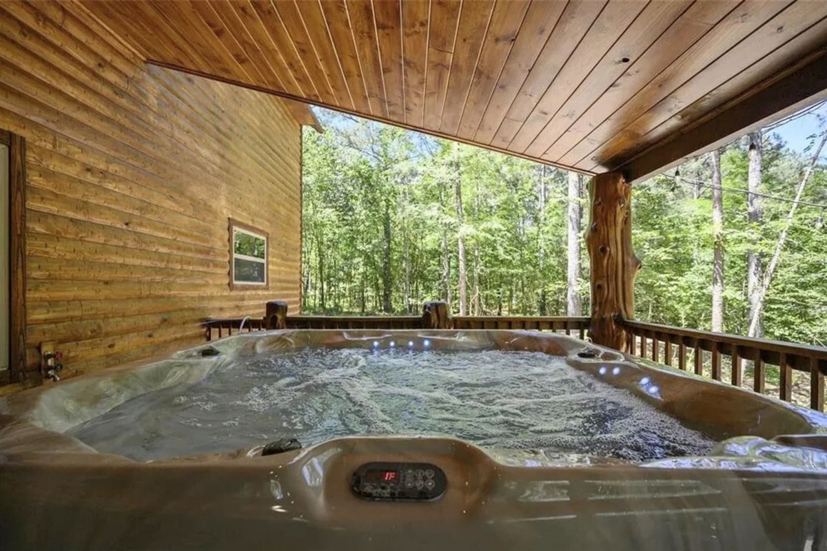 Soak in warm, bubbling waters surrounded by serene forest views—ultimate relaxation for family or friends.