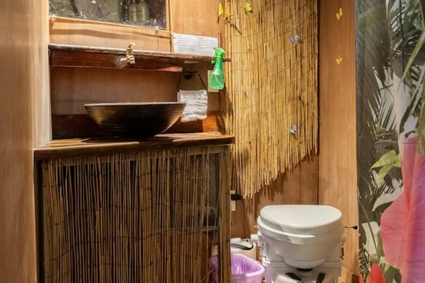 fully functional bathroom with running hot/cold water and compost toilet