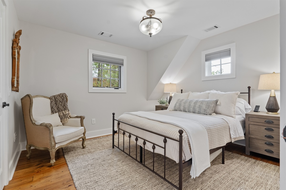 The fourth bedroom features a queen bed and a closet, providing a comfortable and functional space for guests.