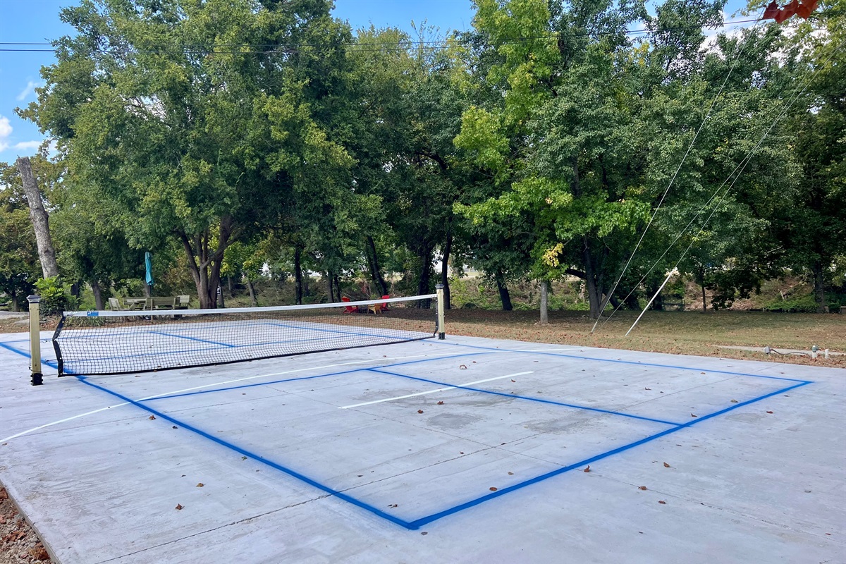 Pickle ball paddles are located in the grill area.