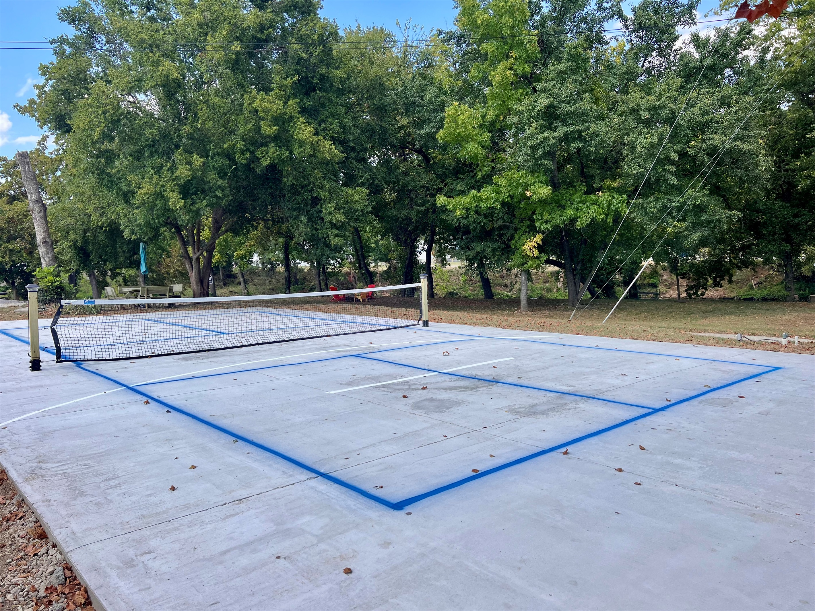 Pickle ball paddles are located in the grill area.