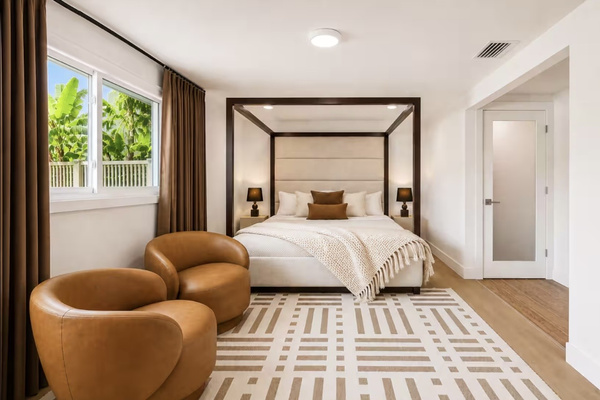 Private king bedroom with reading chairs and peaceful retreat