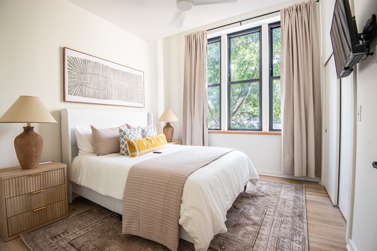 Peaceful bedroom retreat with natural light and cozy bedding
