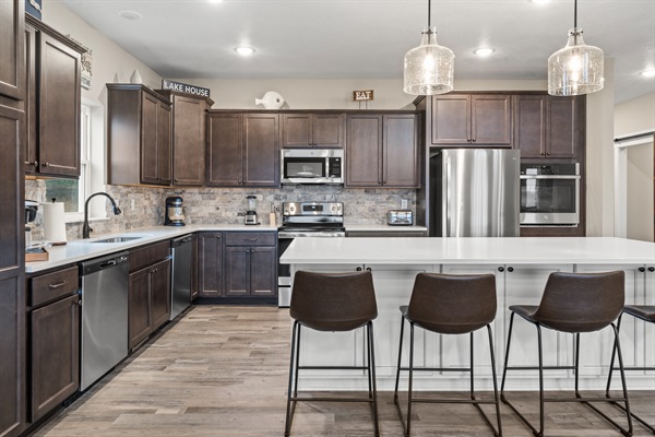 Kitchen has coffee maker, mixer, toaster, blender, large pots, pans, cookie sheets, griddle, silverware, dishware, glassware, utensils, etc. 