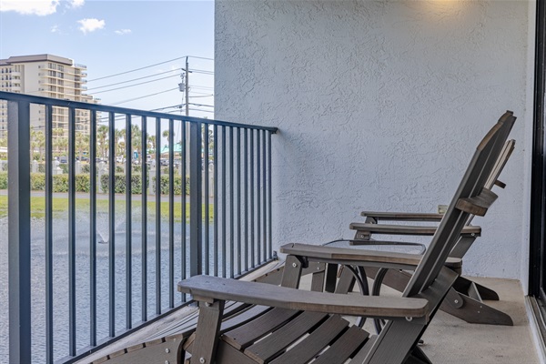 Balcony seating overlooking the golf course water feature
