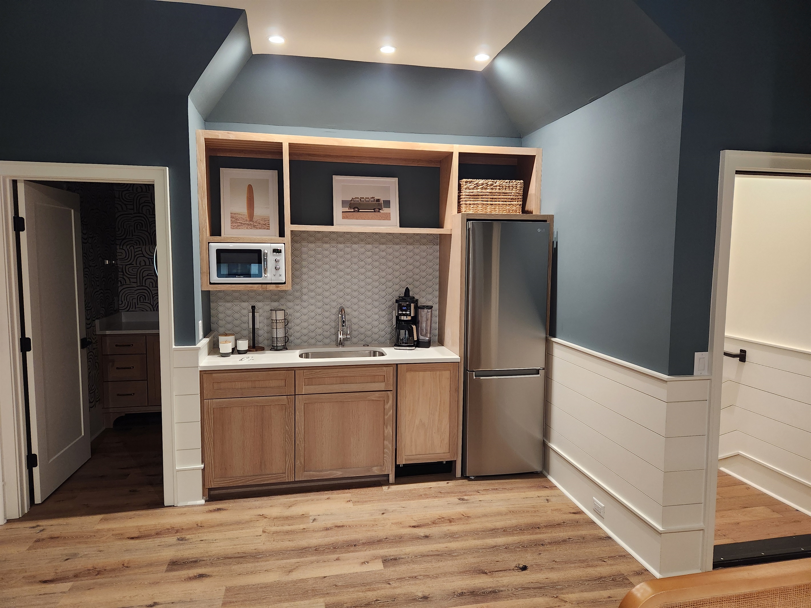 Suite over garage features a coffee bar with medium fridge