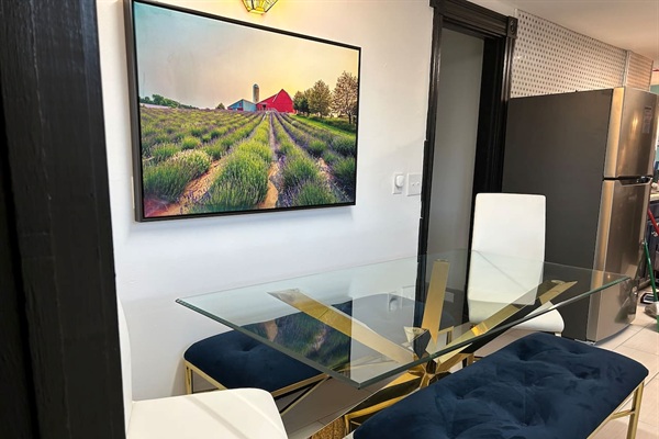 Table slides back to wall for additional space.