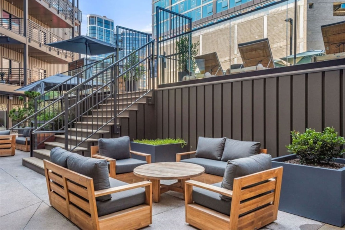 Lower pool deck patio area - tons of seating - public area in the building and guests are encouraged to use during their stay with us!