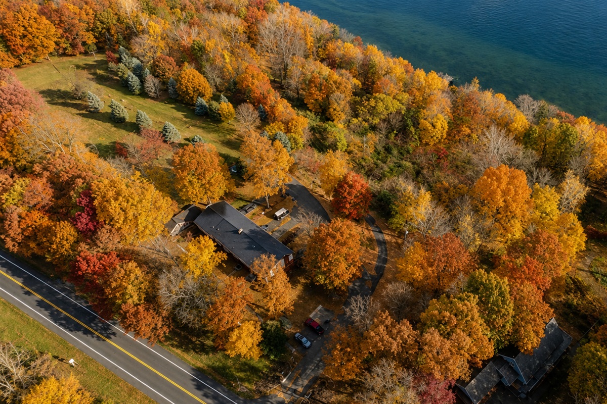 Arial view of the townhomes surrounded by beautiful trees and Cayuga lake.   Experience the vibrant colors from above and the tranquil waters below. 