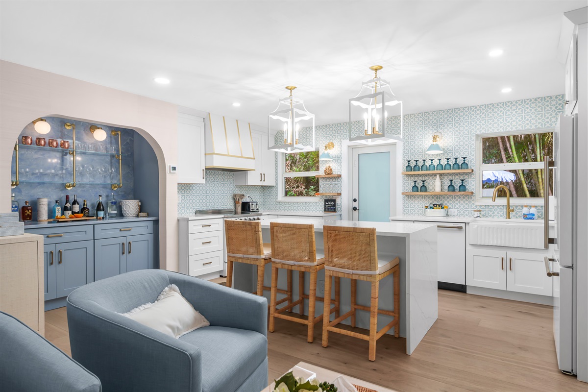 The heart of the home&mdash;this beautifully designed kitchen features a spacious island and breakfast bar, perfect for gathering and entertaining.