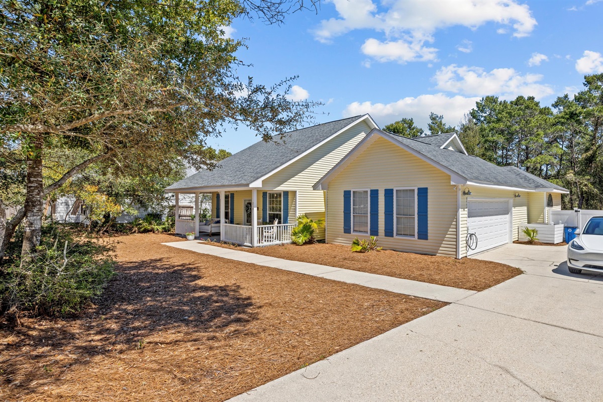 Spacious driveway and overflow parking makes arrival stress free- perfect for large families and a rare find in Inlet Beach.