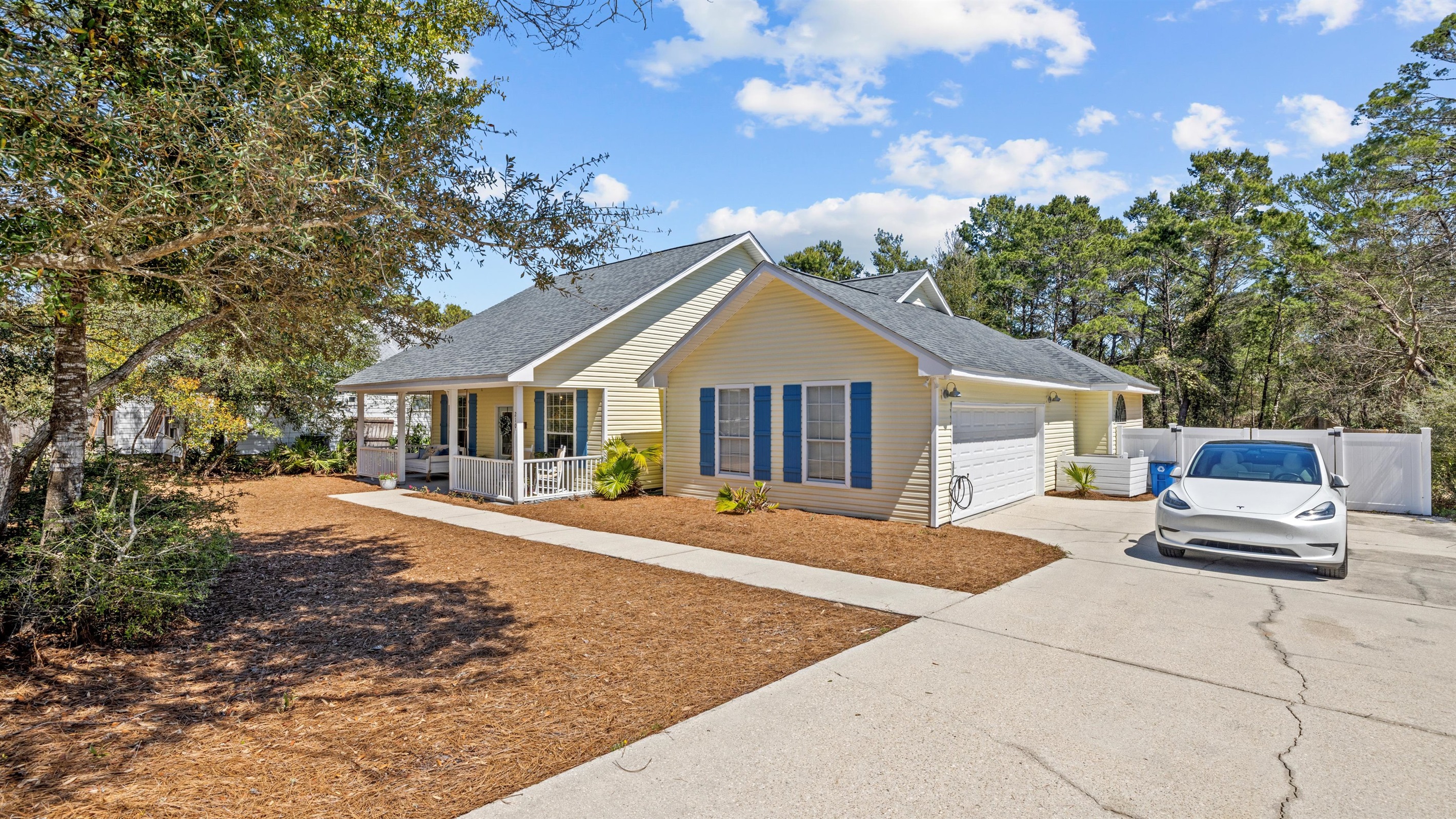 Spacious driveway and overflow parking makes arrival stress free- perfect for large families and a rare find in Inlet Beach.