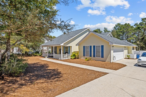 Spacious driveway and overflow parking makes arrival stress free- perfect for large families and a rare find in Inlet Beach.
