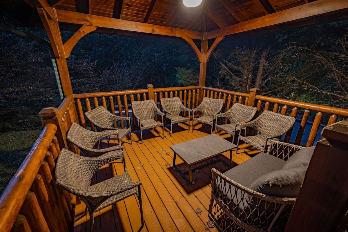 Private covered gazebo with seating for 8. Outdoor entertaining space for groups at The Crown Jewel &mdash; luxury Gatlinburg cabin rental for 12.