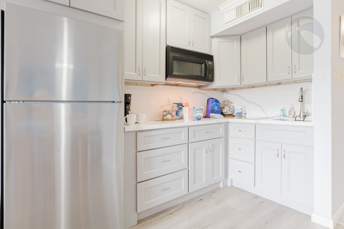 The bright kitchen is ready for your delicacies