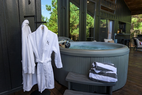 Slip into your plush robe and unwind in the bubbling hot tub surrounded by tall pines and peaceful forest air.