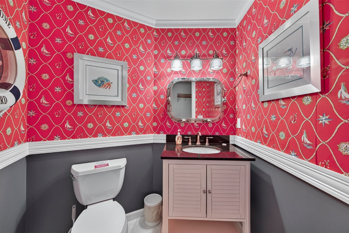 Fun and vibrant nautical-themed powder room full of character.