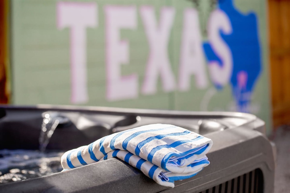 Relax in the hot tub and soak in the Texas vibes!  Towels are ready for you to unwind after a long day of fun. Perfect for your group’s getaway, offering both comfort and a cool Texas backdrop! Enjoy your stay!