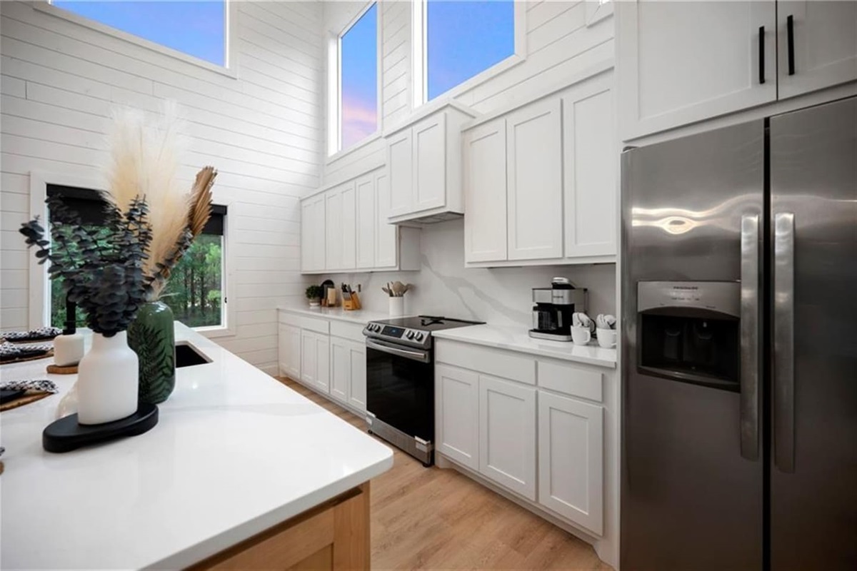 Cook, gather, and sip coffee at sunrise—this stylish kitchen is as functional as it is beautiful.