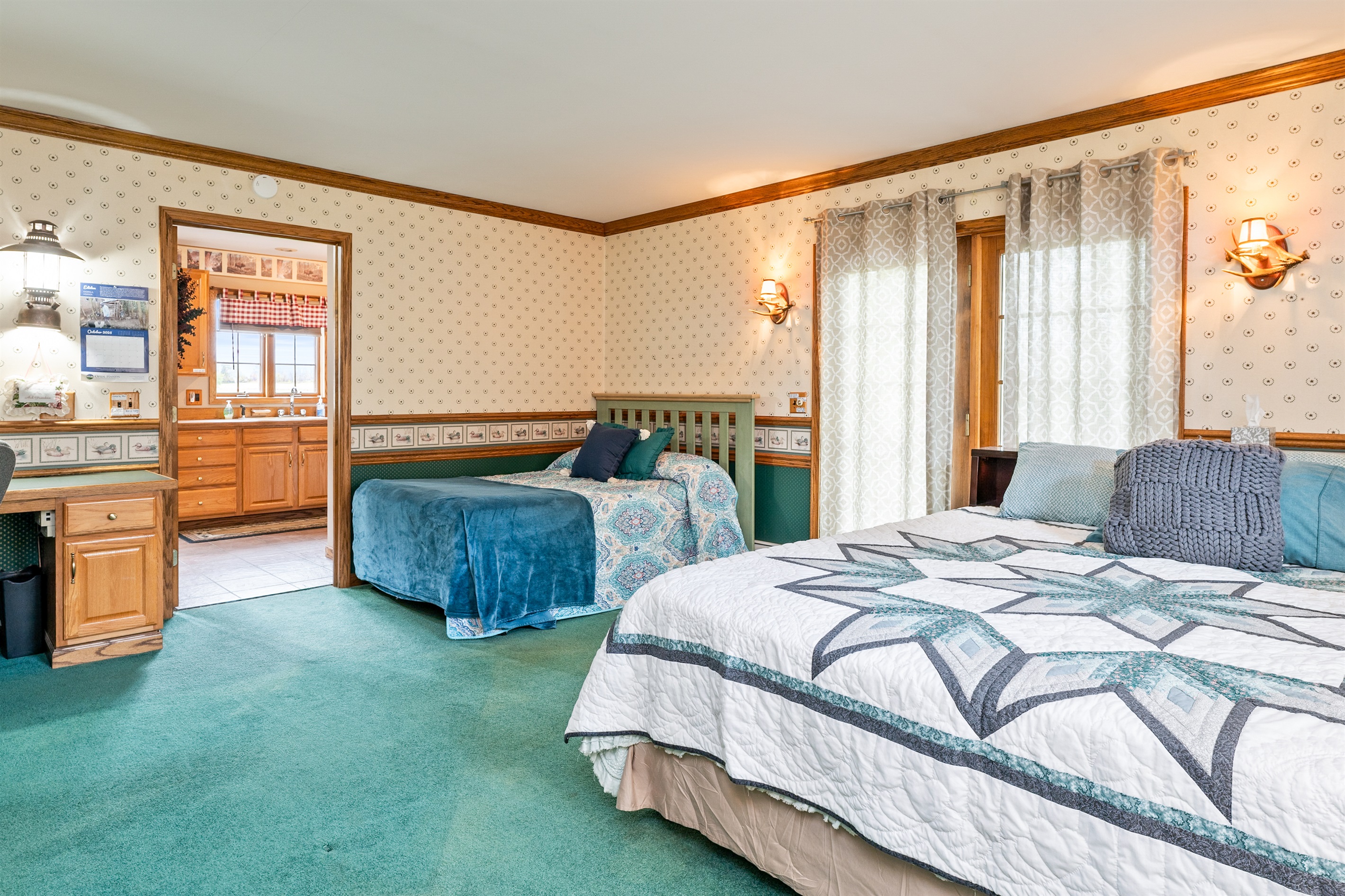 Main floor king bedroom with additional double bed