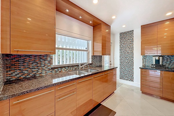 Door to the side yard, grill, and garage/laundry. It is nice being able to go in and out directly from the kitchen. 