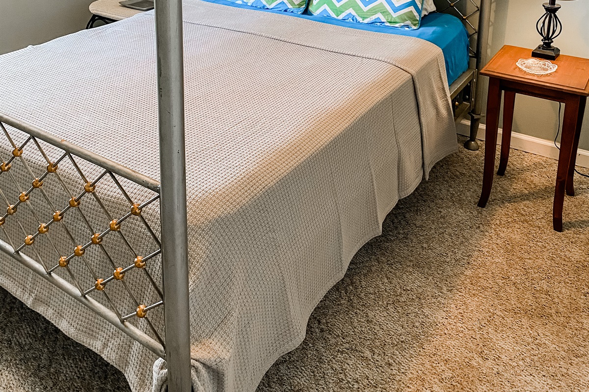 Bedroom with Queen bed, closet and views of the cove.