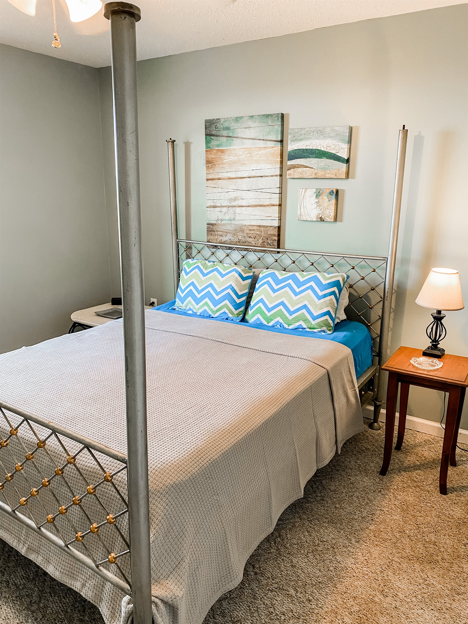 Bedroom with Queen bed, closet and views of the cove.