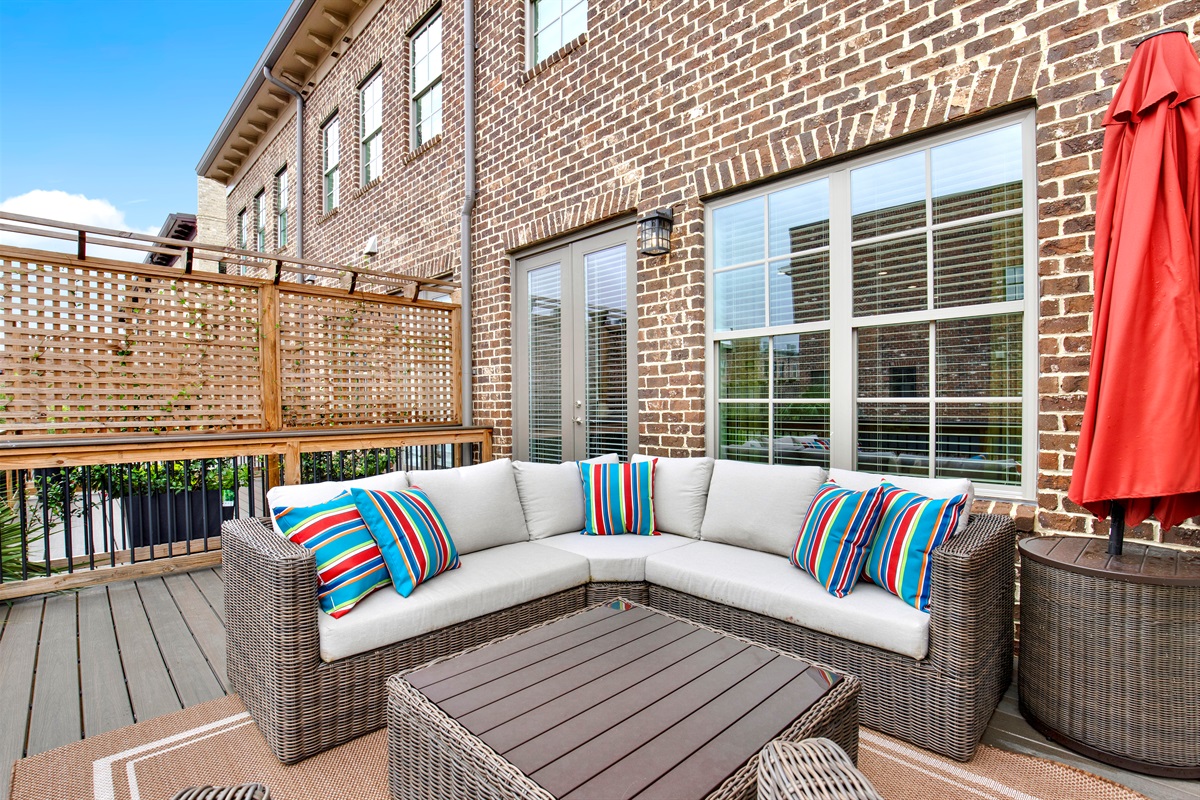 2nd floor Outdoor patio with chair and sectional seatingoff of the living room