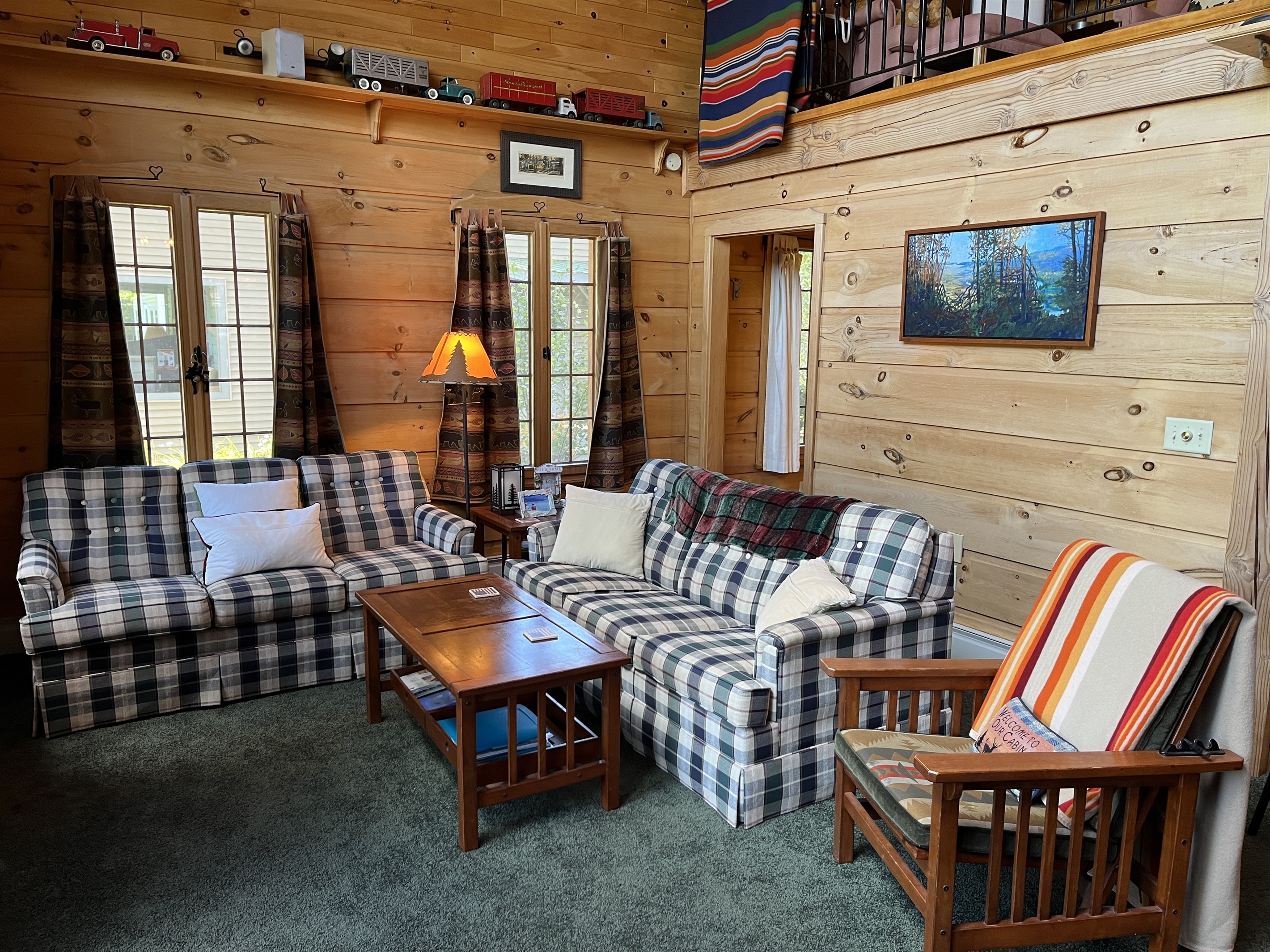 Living area with sleeping loft above