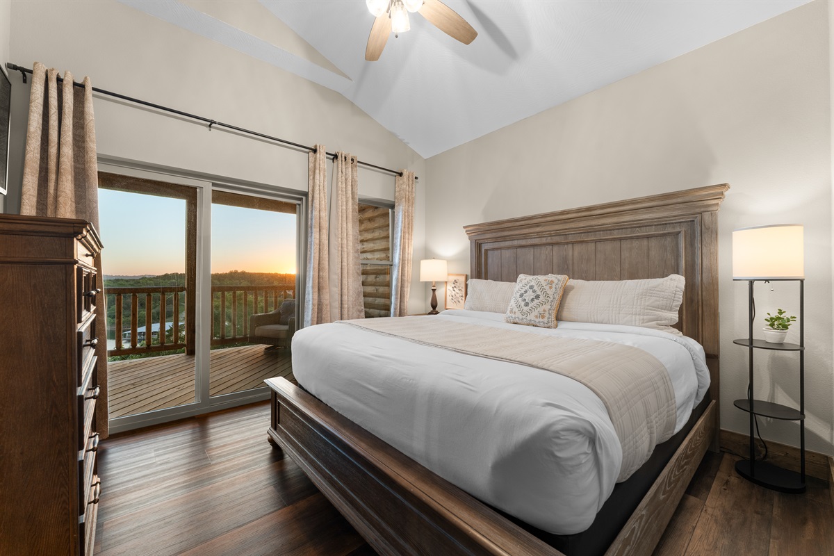 Wake up to lake views from the upstairs king bed with private balcony access.