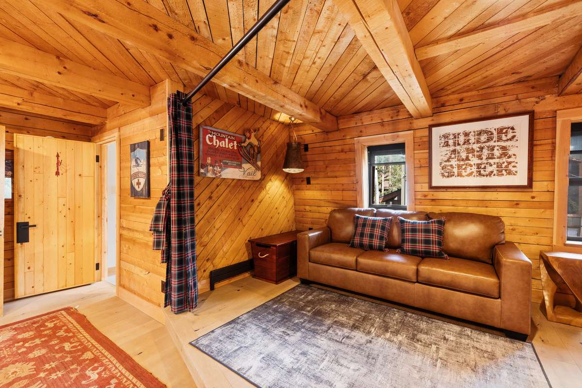 Upper level loft/multi-function living space. In this photo, the partition is open. Bathroom seen on far left. 