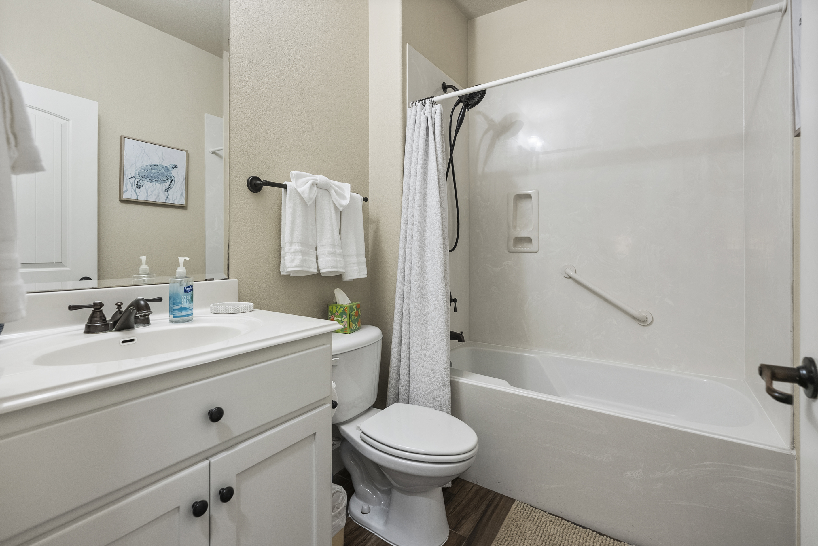 Full guest bathroom conveniently located near the guest bedrooms.
