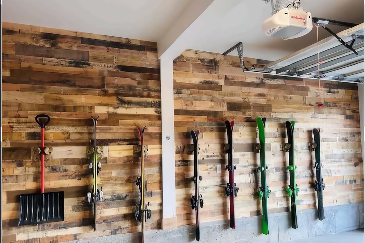 Wall-mounted ski racks and gear hooks for easy organization.